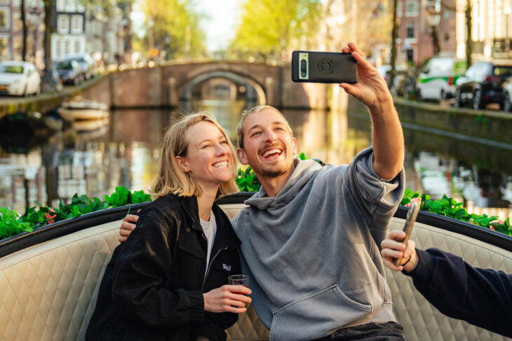 Young couple on a romantic Amsterdam boat tour