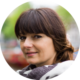 Portrait of a smiling woman. Female tourist in Amsterdam.