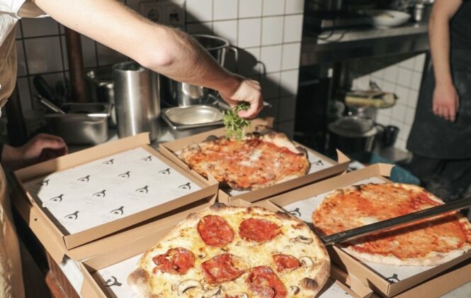 Pizzas in a kitchen. Tasty food in Amsterdam.
