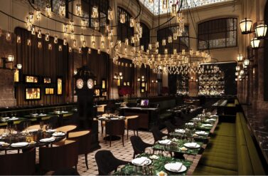 Luxurious dining room with elegant setup. Tables set for a fine meal.