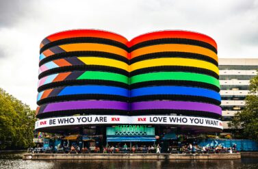 A colourful building in the shape of two cylinders.