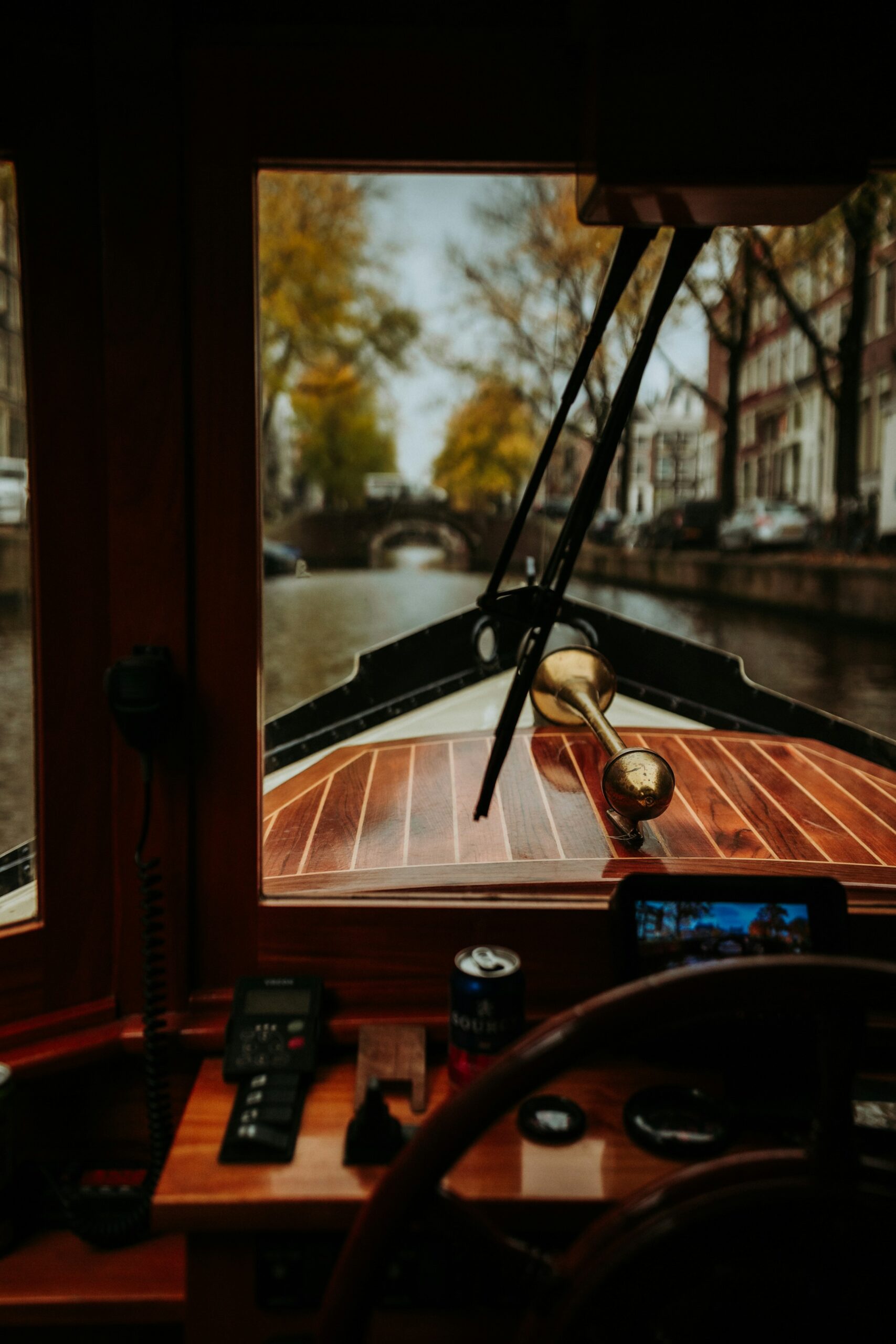 A boat's interior with a canal view. Amsterdam city trip.
