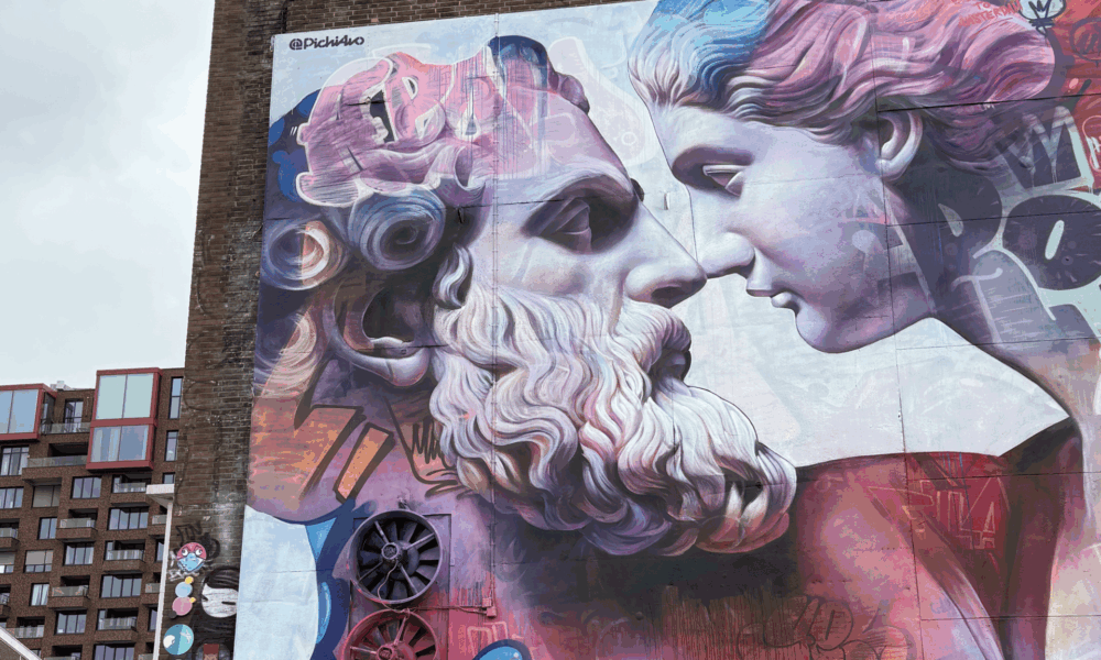 A black and white street art mural in Amsterdam. The image appears to be distressed.