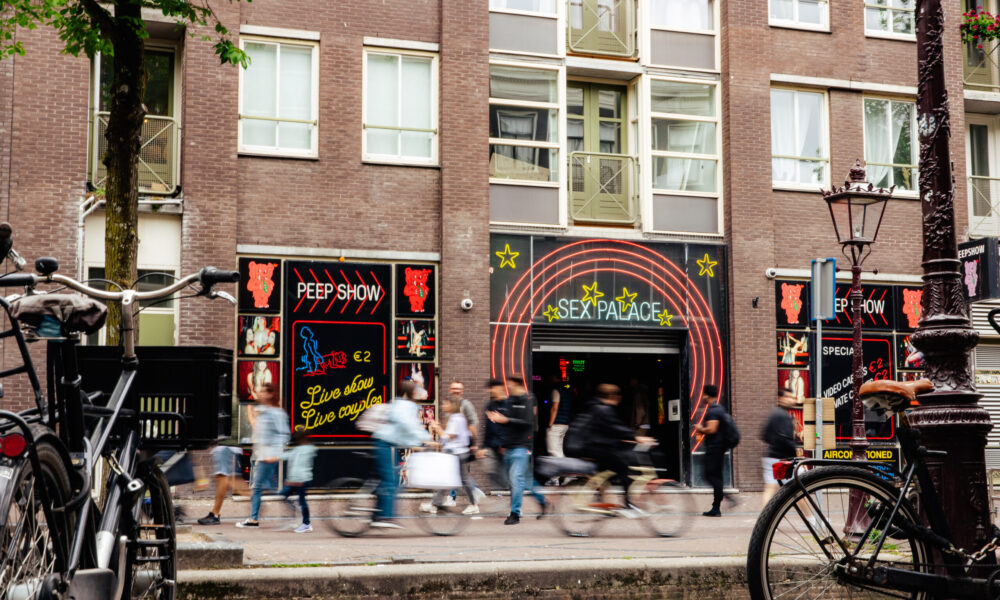 People walking on a sidewalk in Amsterdam