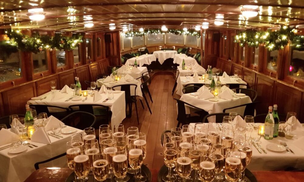 Luxury dining setup on a boat. Glasses and white tablecloths.