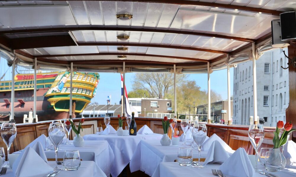 A beautifully set table on a canal boat for dinner. Amsterdam city trip.