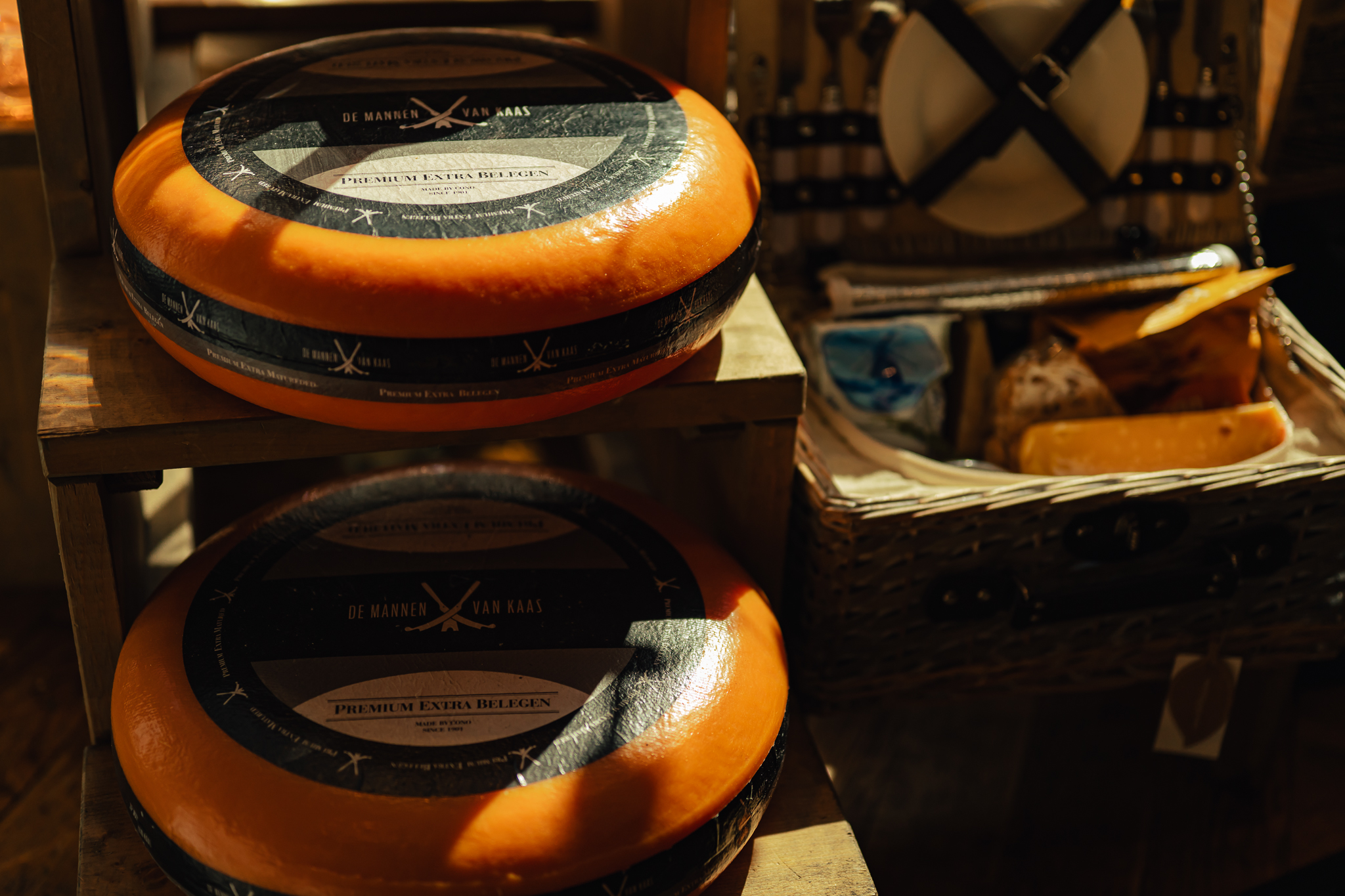 Dutch cheese wheels on display. A variety of cheeses for sale.