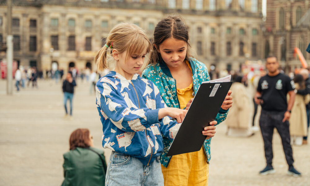 Woman and child looking at map in Amsterdam